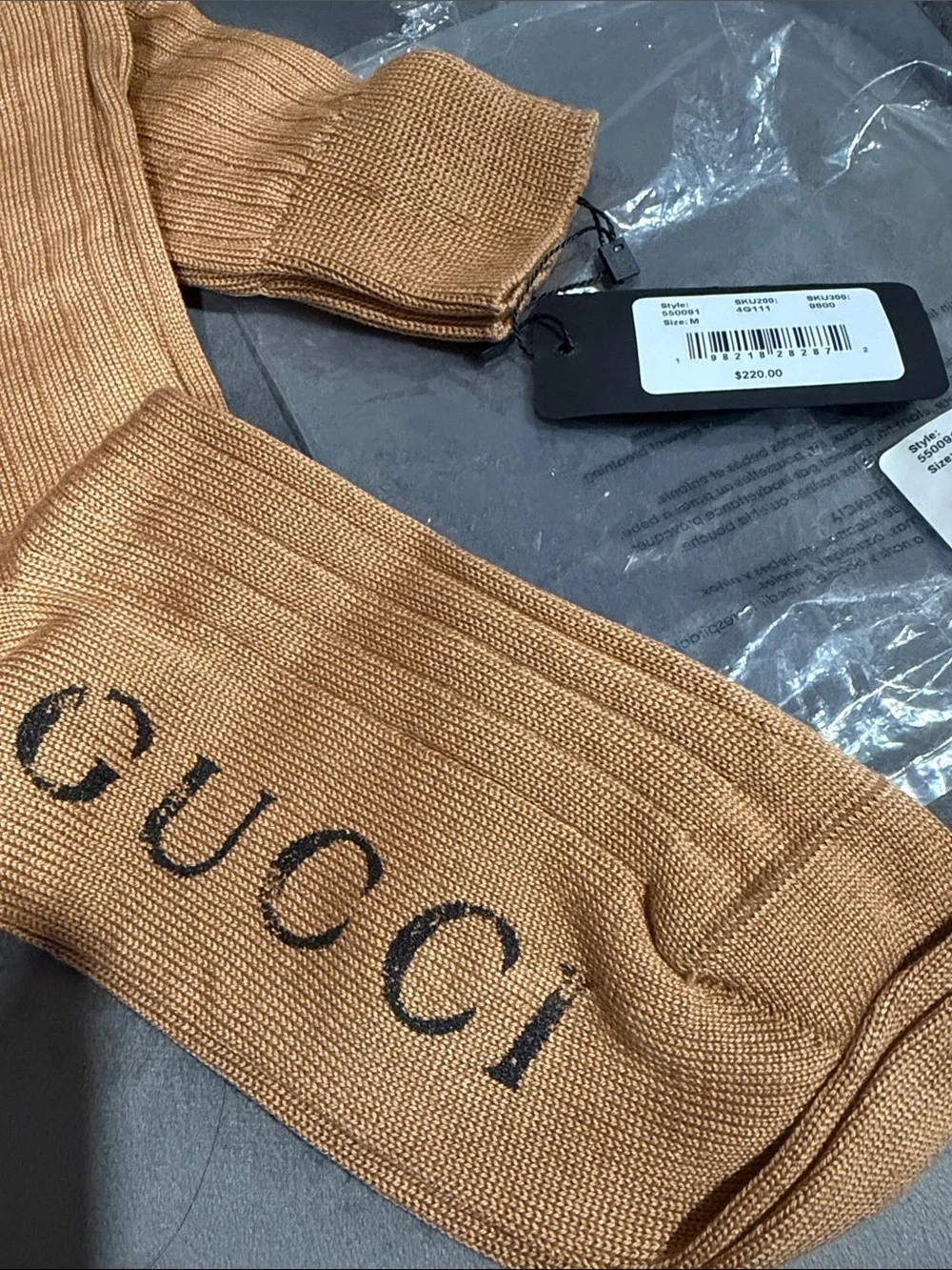 Gucci 1 pair of long sock size M. Retails $220.